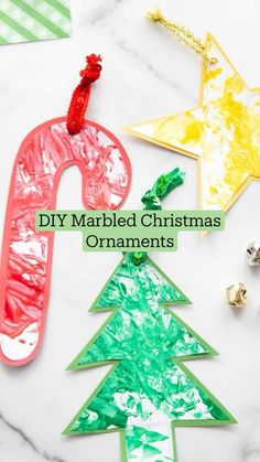 paper plate christmas tree ornaments with the words diy marbled christmas ornaments