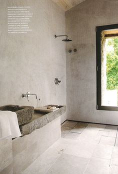 a bathroom with two sinks and a large window