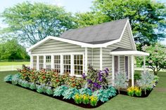 a small house with lots of flowers in the front and side garden beds around it