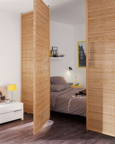 a bedroom with wooden slats on the walls