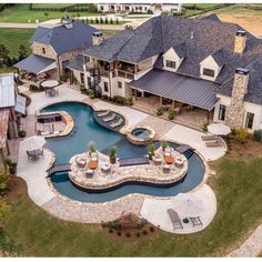 an aerial view of a large home with a pool