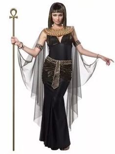 an egyptian woman dressed in black and gold, holding a staff with her arms outstretched