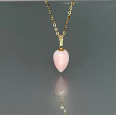 Beautiful natural Peruvian pink opal pendant necklace. The hand polish pendant has a beautiful soft pink color and is strung on a 14 gold-filled chain. It is perfect for layering or looks great when worn alone. *pendant measure: 27x10mm would (with the bail) *Metal: 14K Gold-filled/ Sterling Silver *necklace length: 45 cm /18 inch Solid gold, 14K gold-filled, sterling silver, and gemstones are my materials of choice, I love working with these beautiful natural gems and hope that you will love th Pink Opal Pendant Necklace As A Gift, Pink Opal Gemstone Pendant Necklace, Yellow Gold Pink Opal Jewelry For Gift, October Birthstone Necklace, Natural Gemstone Necklace, Necklace Opal, Opal Pendant Necklace, Soft Pink Color, Types Of Gemstones