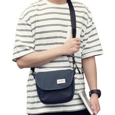 If you're looking for a practical and stylish shoulder bag to accompany your daily travels, you'll love this small canvas crossbody bag. This men's canvas crossbody bag offers a modern and trendy style for many occasions. Made of canvas, it is a durable and resistant bag that is perfect for everyday use. Discover its practicality, comfort and elegance. A small, elegant and modern canvas messenger bag This small messenger bag for men is sleek and original, with a modern style that adds a touch of Gray Canvas Shoulder Satchel, Casual Canvas Shoulder Bag With Anti-theft Pocket, Canvas Shoulder Bag With Anti-theft Pocket For Travel, Rectangular Gray Shoulder Bag With Anti-theft Pocket, Gray Crossbody Shoulder Bag With Anti-theft Pocket, Messenger Bag For Men, Laptop Messenger Bags, Small Messenger Bag, Stylish Shoulder Bag