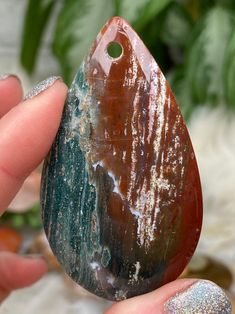 Beautiful and unique jasper pendants from Madagascar! 99% of these are going to be ocean jasper, but there are some other forms of jasper mixed in. You will see a couple kambaba jasper, polychrome jasper, agatized jasper, and red jasper. Almost all of these have a single polished side, but there are a couple that you'll get a polished back too! There are a variety of shapes as well: circles, ovals, hearts, tear drops, and other unique cuts. You will get to choose exact! The holes may be a bit wo Jasper Meaning, Kambaba Jasper, Polychrome Jasper, Tear Drops, Crystal Accessories, Crystal Meanings, Jasper Pendant, Red Jasper, Ocean Jasper