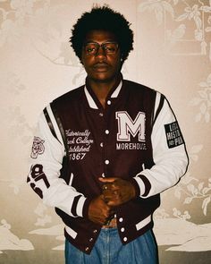 A symbol of school spirit and authentic Morehouse cool, the varsity jacket is an iconic LegacyHistoryPride silhouette. The details on the sleeves with the "TIGER" mascot and "1867" along with "The HOUSE" motto on the back screams school pride with a sporty style. It’s crafted in wool with leather sleeves and pockets, and finished with signature striped ribbed trim. Tiger Mascot, School Jacket, Pride Wear, Leather Sleeves, School Pride, Men Fashion Casual Outfits, Leather Sleeve, The Tiger