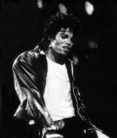 michael jackson performing on stage with his hands in his pockets