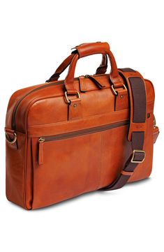 Keep all of your workday essentials well organized in this Italian leather briefcase that has space for your laptop and more.Closure: Two-way top-zip closure.Exterior features: Top carry handles with snap wrap; removable, adjustable shoulder strap; zip pocket with RFID-blocking fabric; key fob lanyard; trolley strap.Interior features: Single gusset interior with full-sized laptop pocket and dedicated tablet pocket; full-length pen sleeves and additional pockets for cables, headphones and charger Fabric Key Fob, Brief Case, Baby Gear Essentials, Pet Mom, Rollerball Perfume, Makeup Gift, Fragrance Design, Leather Briefcase, Laptop Pocket