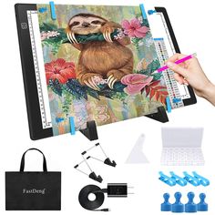 an image of a sloth on a notebook with accessories