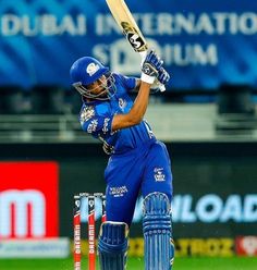 a cricket player hitting the ball with his bat