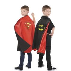 two young boys dressed up as batman and robin wayne, standing next to each other