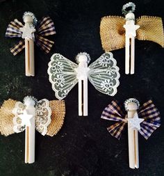 four little angel candles with lace on them sitting next to straw bags and twine bows