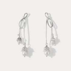 Elevate your elegance with our Silver Lily Of The Valley Bow Earrings. Crafted in sterling silver, these delicate earrings showcase the iconic Lily of the Valley motif in a charming bow design. A touch of femininity and nature-inspired grace, these earrings are perfect for adding a subtle yet timeless accent to your look.  🎀 DETAILS Materials:  Sterling  Silver, Pearl Size: 2.09"* 0.31 "(5.3cm*0.8cm) Weight: 7.4g/pr Silver Feminine Flower Earrings For Formal Occasions, Silver Dangle Flower Earrings Feminine, Feminine Silver Dangle Flower Earrings, Silver Feminine Flower Earrings, Feminine Silver Drop Flower Earrings, Feminine Silver Flower Drop Earrings, Feminine Silver Earrings For Anniversary, Elegant Silver Drop Flower Earrings, Mermaid Pendant Necklace