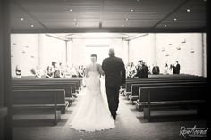 the bride and groom are walking down the aisle