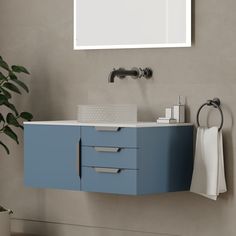 a bathroom with a sink, mirror and towel dispenser on the wall