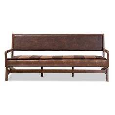 a brown leather bench sitting on top of a white floor next to a wooden frame