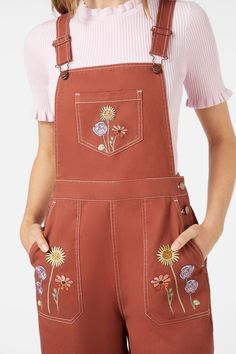 Rust coloured overall with embroidered fresh cottage style floral celebrating spring. A bib & brace style with full length wide cut leg- bib & brace style with adjustable sliders - front bib, leg & back pockets - side buttons - available in toffee Product Code: PGFY099 Brown Overalls With Pockets For Spring, Brown Cotton Overalls For Spring, Cotton Jumpsuits And Rompers With Adjustable Straps, Cotton Jumpsuit With Adjustable Straps And Bib Front, Spring Cotton Overalls With Adjustable Straps, Spring Cotton Shortalls With Bib Front, Spring Cotton Shortalls With Suspenders, Spring Floral Print Overalls, Spring Bib Front Overalls With Adjustable Straps