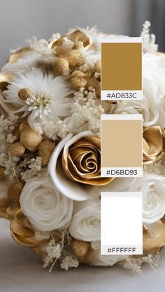 a wedding bouquet with white flowers and gold accents on the bottom, in shades of beige