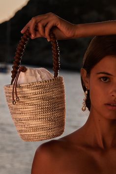 A luxe, take on the bag that started it all - our signature Lunchpail, now finished with an intricately hand-braided Napa Leather handle, from a centuries old Italian atelier, heralded for it’s world class quality and attention to details. Cesta baskets are handwoven by female artisans in Rwanda, Africa, using locally sourced, renewable resources. Each piece is hand finished in Italy with carefully chosen, sustainable materials. This basket took a master craftswoman over 6 days to weave. 6" W x French Riviera Style, Rwanda Africa, Lunch Pail, Boho Bags, Gender Equality, Social Impact, Beach Photoshoot, Basket Bag, Women Artisans