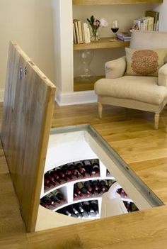 a hole in the floor that is filled with wine bottles