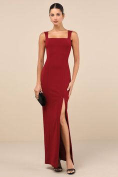 a woman wearing a red dress with a slit