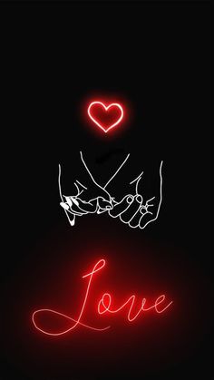 two hands holding each other with the word love written on them in red neon lights