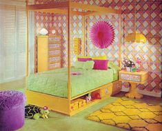 a bedroom decorated in pink, yellow and green with a four poster bed surrounded by colorful rugs