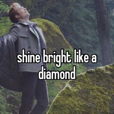 a man standing in the woods with his back turned to the camera and texting shine bright like a diamond