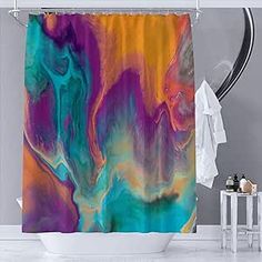 a colorful shower curtain hanging in a bathroom