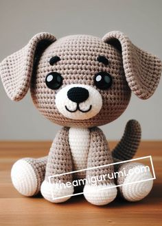 a crocheted dog sitting on top of a wooden table