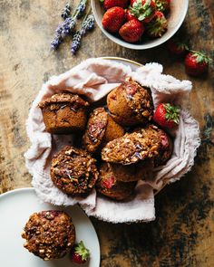 muffins and strawberries on a wooden table