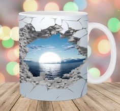 a coffee mug with an image of the ocean through a hole in it's side