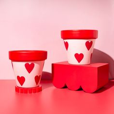 Pink and red product photography and red and pink hand painted heart plant pots. Red and pink background with Moodelier wiggle prop and plinthy plinth Clay Plant Pots, Creative Product Photography, Wood Photography, Woods Photography, Cute Canvas Paintings, Cute Canvas