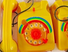 two yellow telephones sitting next to each other