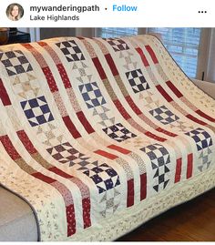 a couch with a quilt on top of it