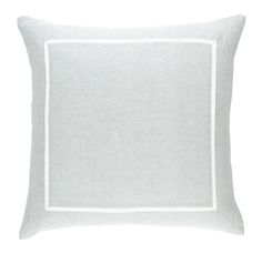 a light gray pillow with white piping on the front and side, sitting on a white background