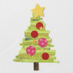 a christmas tree made out of pieces of green paper with red balls and stars on top