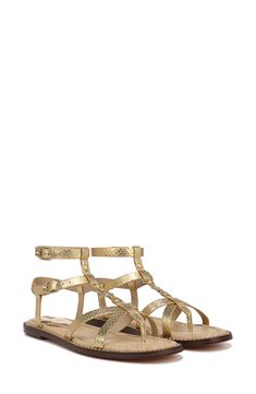 Luxe details like a beaded welt and milgran buckles elevate this strappy leather sandal that's ready to complement your warm-weather looks. Adjustable straps with buckle closures Leather upper and lining/rubber sole Imported Luxury Strappy Sandals With Buckle Closure, Gold Leather T-strap Sandals With Buckle, Gold Sandals With Adjustable Strap For Spring, Gold Flat Heel Sandals With Buckle Closure, Gold Open Toe T-strap Sandals With Buckle Closure, Gold Open Toe T-strap Sandals With Buckle, Adjustable Gold Sandals With Buckle Closure, Gold Leather Sandals With Strap, Gold Leather Strap Sandals