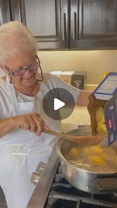 an older woman is cooking in the kitchen