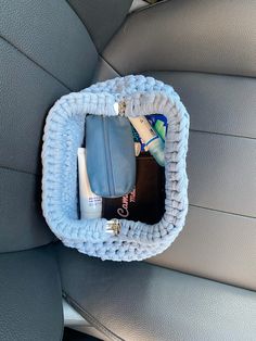 the inside of a car seat is filled with personal care items