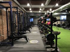 a gym with rows of exercise equipment