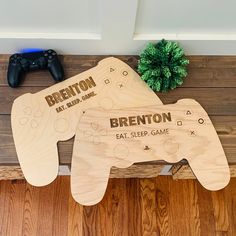 two wooden game controllers sitting on top of a table