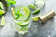 a mojito cocktail with lime and mint garnish