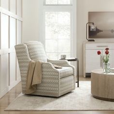 a living room filled with furniture and a large window