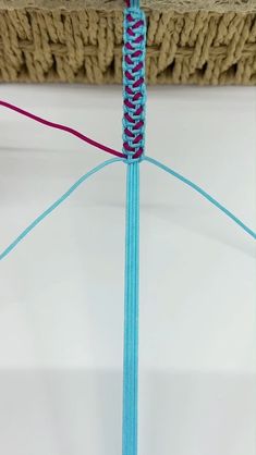 a close up of a piece of blue string