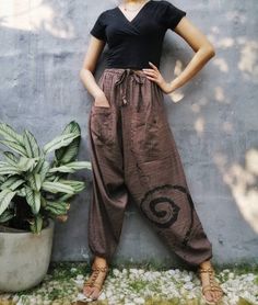 "The harem style trousers made from cotton fabric 100%with an elasticated smock waist and ankles they provide a comfortable lightweight fit, perfect for casual wear, festivals, yoga, holidays as well as pairing with a plain top to get that popular look. D I S C O U N T & P R O M O T I O N ❤ Buy 2 or more items, get 10% off ❤ Buy 4 or more items, get 15% off ENTER the coupon code: IYARA015 ❤ Buy 6 or more items, get 15% off ENTER the coupon code: IYARA020 PLEASE NOTE I can not apply a discoun Bohemian Brown Cotton Pants, Bohemian Relaxed Fit Harem Pants For Festival, Brown Casual Pants For Festivals, Casual Brown Pants For Festival, Bohemian Brown Cotton Harem Pants, Brown Cotton Ankle-length Harem Pants, Bohemian Parachute Pants For Yoga With Elastic Waistband, Bohemian Parachute Pants For Yoga, Relaxed Fit Harem Pants For Summer Festivals