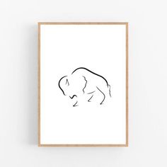 a black and white drawing of an elephant on a white background framed in wood frame