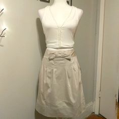 Size 8 Beautiful Light Stone Colored Skirt. Has A Front Bow Detail The Skirt Has Light Pleating All Around With A Zipper And Button Closure At The Back The Best Part, It Has 2 Hidden Pockets! This Is A Fabulous And Comfortable Skirt For Work. Bin #01 Skirt For Work, Comfortable Skirts, Khaki Skirt, Work Skirts, Adrienne Vittadini, Beautiful Lights, Bow Detail, Stone Color, Womens Skirt