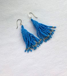 These fun fringe seed bead earrings are inspired by rainy days in the Pacific Northwest. They hang approximately 1.8 inches from the lobe and measure 0.5 inches across their widest point. Beads and Earwires: Each pair is handmade with the highest quality size 11 Miyuki Delica beads. The closure is a sterling silver finding. If you have specific sensitivities I can make your earrings with gold plated findings, just let me know! Packaging: All earrings are individually packaged with care. Additional information: Each pair of earrings is made to order so please allow an extra 1-3 days for me to complete them.  Thanks for supporting hand-crafted goods made with love. Beaded Fringe Drop Earrings As Gift, Unique Handmade Dangle Tassel Earrings, Fringe Beaded Dangle Earrings As A Gift, Dangle Tassel Earrings With Beaded Fringe Gift, Handmade Teardrop Tassel Earrings For Gift, Beaded Fringe Dangle Tassel Earrings As Gift, Unique Fringe Dangle Earrings, Fringe Dangle Beaded Earrings For Gift, Handwoven Tassel Drop Earrings As A Gift