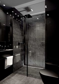 a black and white photo of a modern bathroom